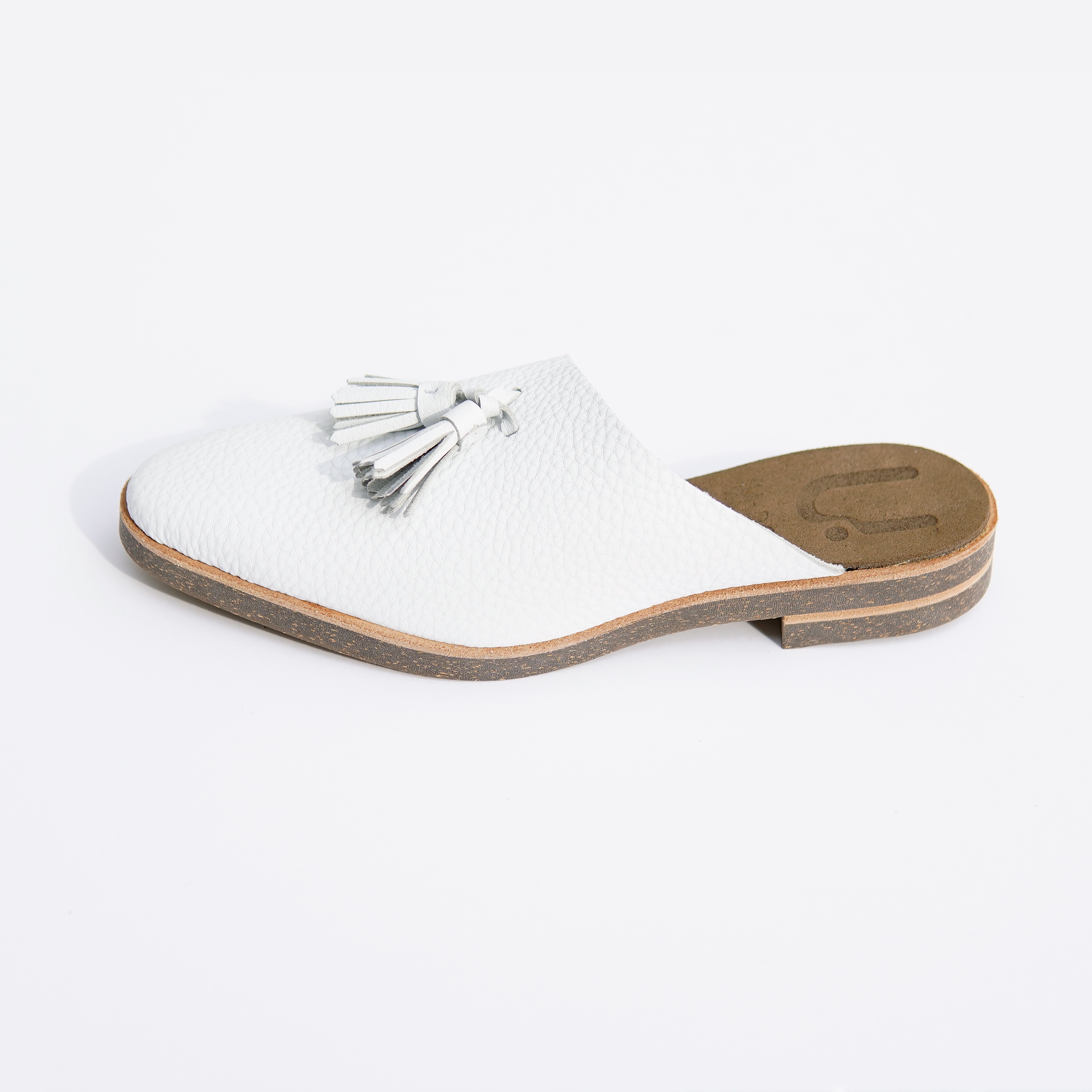 ASYMMETRICAL MULE WHITE TASSEL